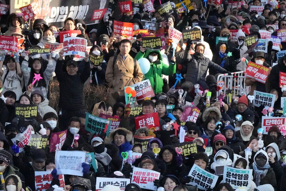 People flooded the streets of Seoul with the news (AP)