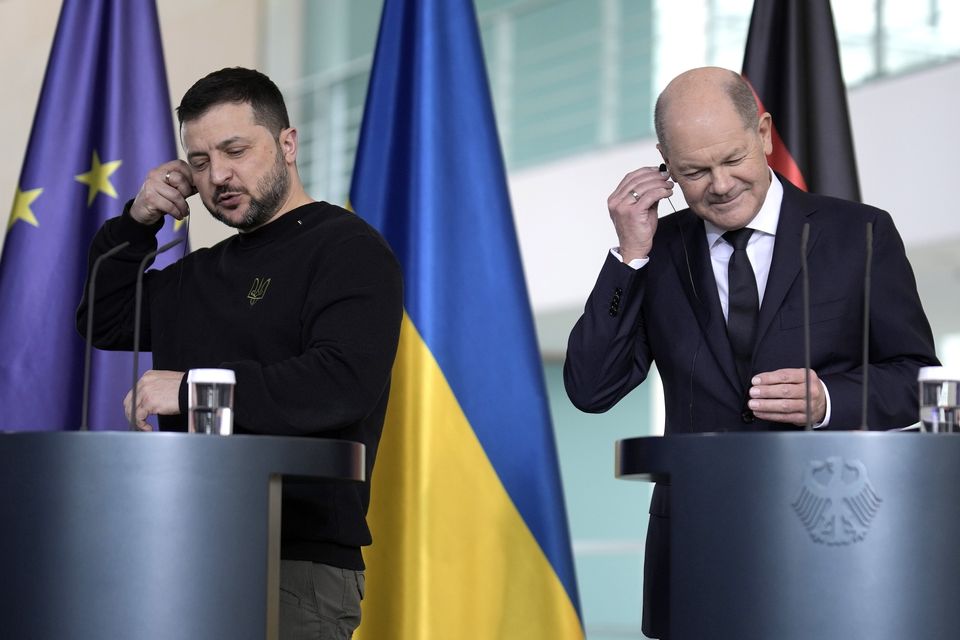 German Chancellor Olaf Scholz, right, and Ukrainian President Volodymyr Zelensky attend a press conference in the chancellory in Berlin (Markus Schreiber/AP)