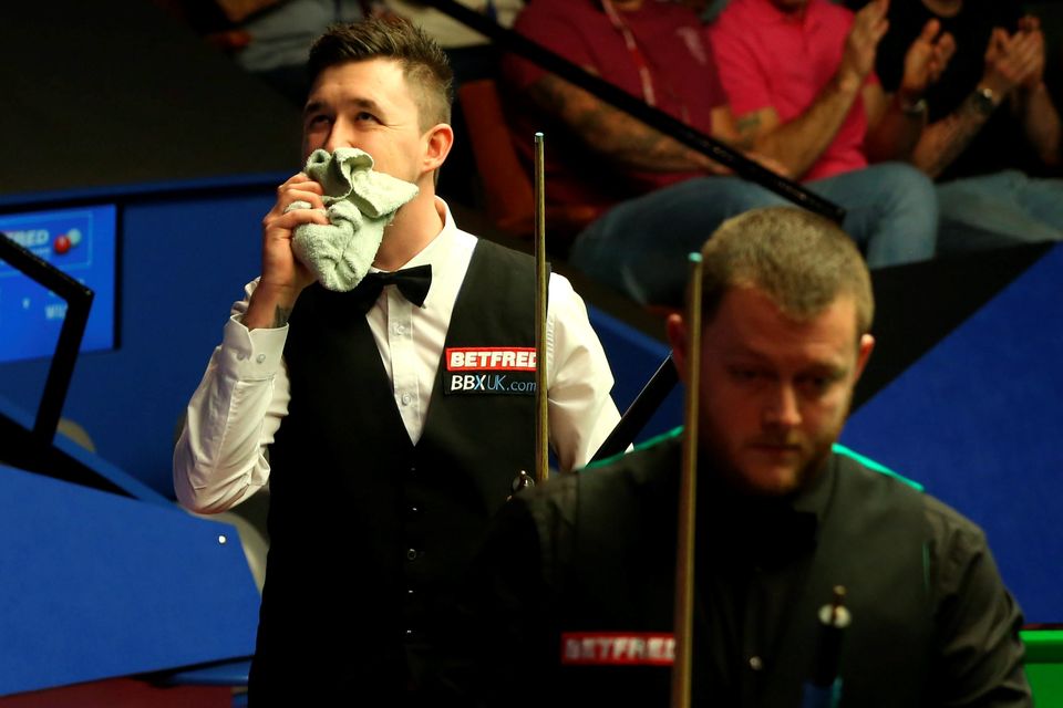Joy and pain: Kyren Wilson shows his delight as defeated Mark Allen makes his exit at the Crucible