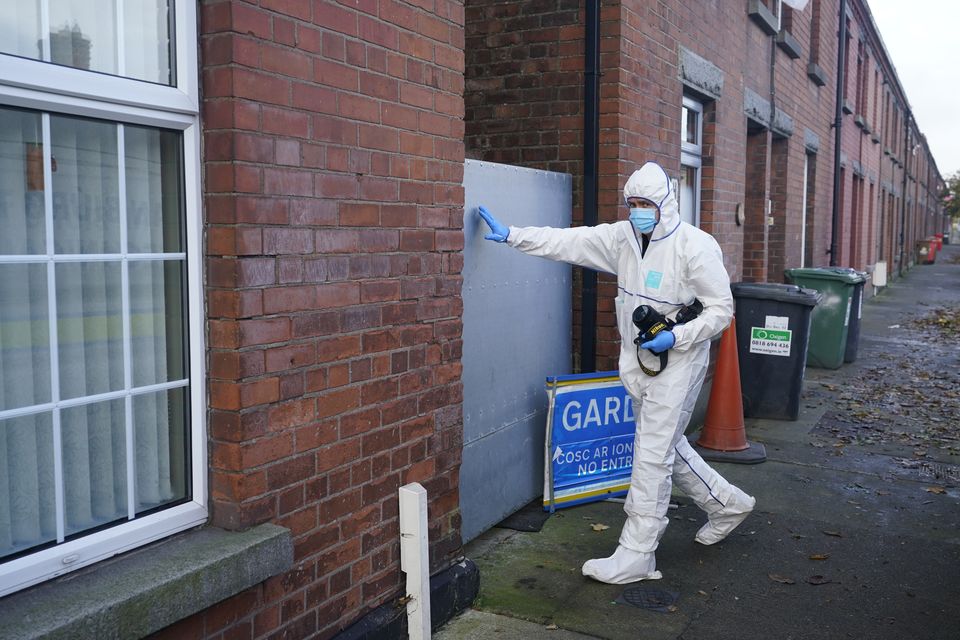 A forensic officer in Dundalk, Co Louth as a house is searched (Niall Carson/PA)