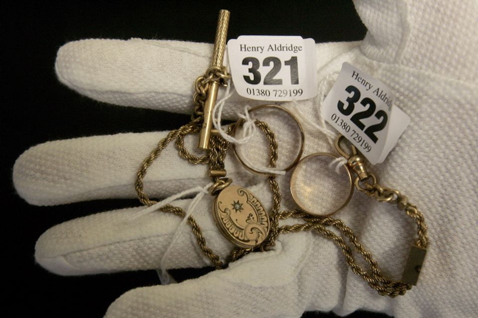 The wedding ring and locket property of Carl Asplund and the wedding ring of Selma Asplund are seen at Henry Aldridge and Son auctioneers in Devizes, Wiltshire, England Thursday, April 3, 2008. The locket and one of the rings were recovered from the body of Carl Asplund who drowned on the Titanic, they are all part of the Lillian Asplund collection of Titanic related items.