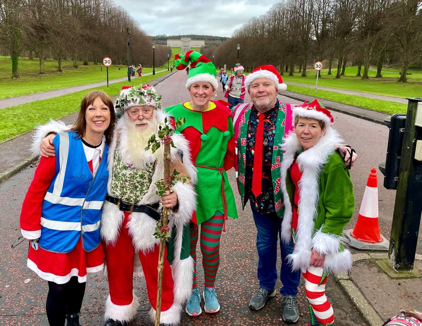 (left to right) Stormont Parkrun race director Marianne Hood, Jimmy McNeilly as Father Christmas, event director Alison Canning, Gary Craig and Una McNeill (David Young/PA)