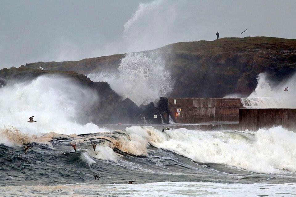 Large waves batter the sea barriers during stormy weather in Portstewart (Photo: PAUL FAITH/AFP via Getty Images)