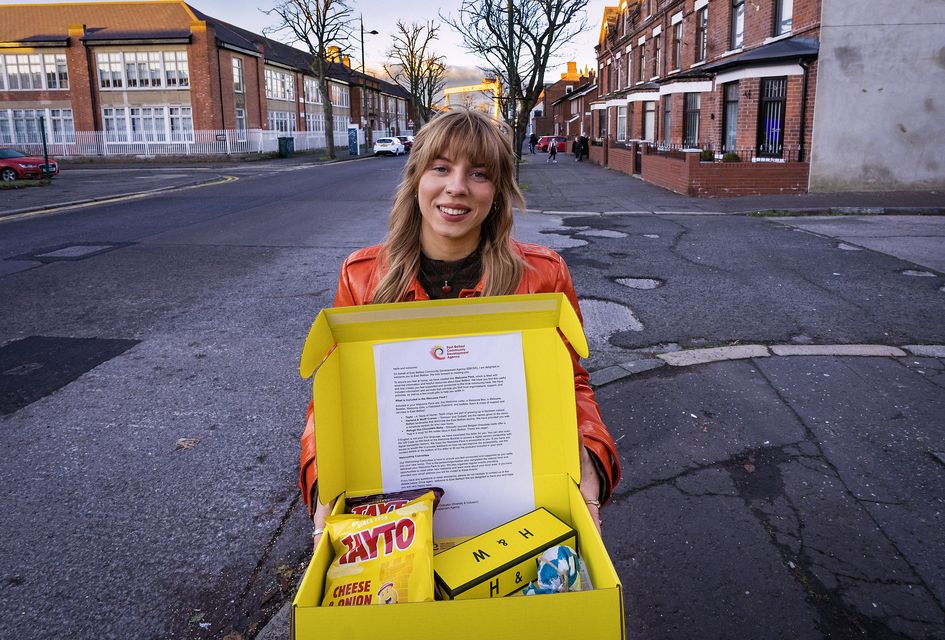 Katy Allen with one of the welcome packs being handed out to people making their home in east Belfast (The National Lottery Community Fund/PA)