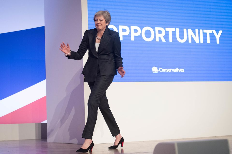 Theresa May danced to Abba as she took to the stage for her Conservative conference speech in 2018 (Stefan Rousseau/PA)