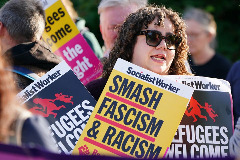 Campaign group Stand Up to Racism organised the counter-protest outside the Cairn Hotel in Bathgate (PA)