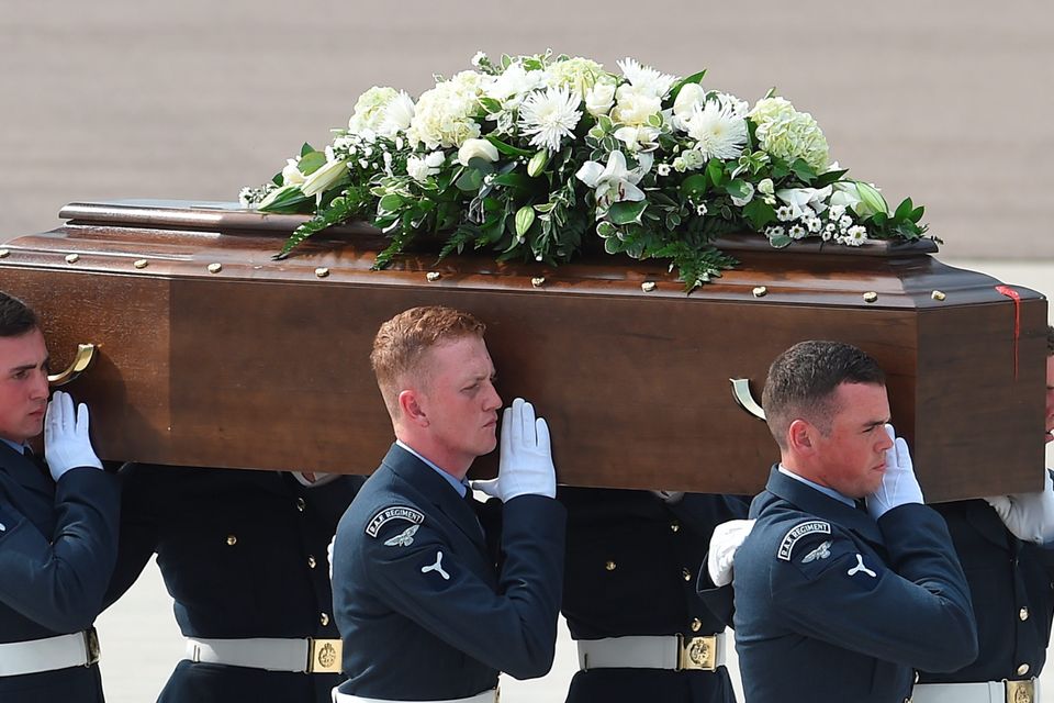 BRIZE NORTON, ENGLAND - JULY 01:  The coffin of John Stollery, one of the victims of last Friday's terrorist attack, is taken from the RAF C-17 aircraft at RAF Brize Norton in Tunisia, on July 1, 2015 in Brize Norton, England. British nationals Adrian Evans, Charles Evans, Joel Richards, Carly Lovett, Stephen Mellor, John Stollery, and Denis and Elaine Thwaites are the first of the victims of last week's terror attack to be repatriated.  (Photo by Joe Giddens-WPA Pool/Getty Images)