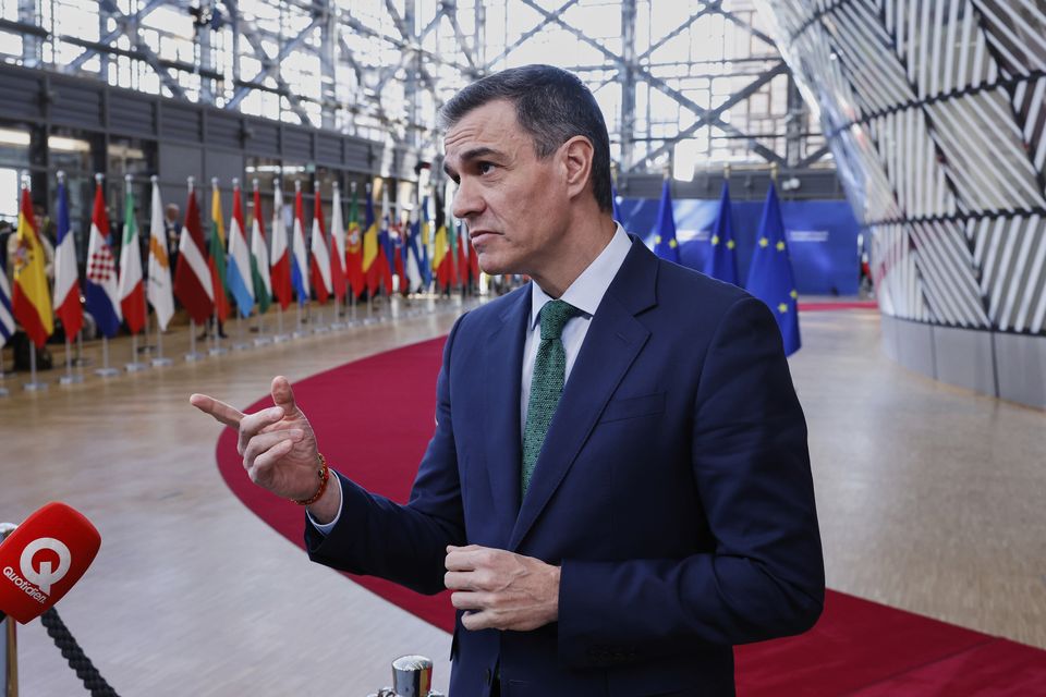 Spanish Prime Minister Pedro Sanchez speaks to the media as he arrives for the summit at the European Council building in Brussels (Omar Havana/AP)