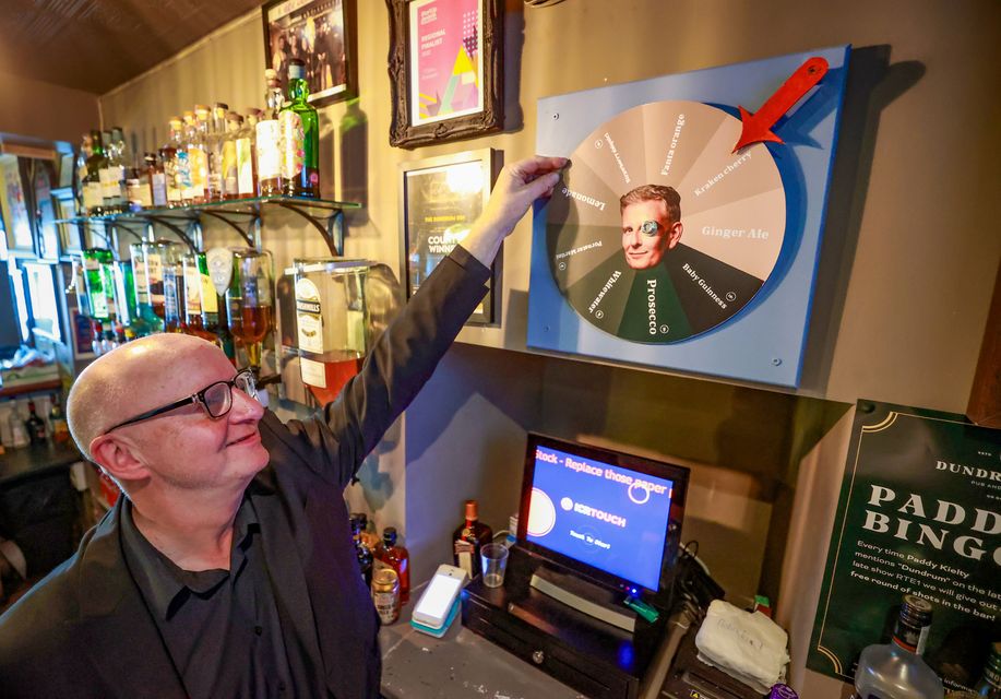 Tom showing off his Patrick Kielty drinks wheel (Credit: Liam McBurney/RAZORPIX)