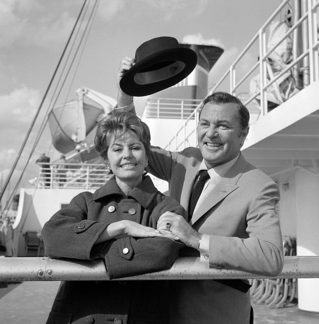 Singer and dancer Cyd Charisse with her husband Tony Martin about to disembark from the SS United States on arrival from New York at Southampton (PA)