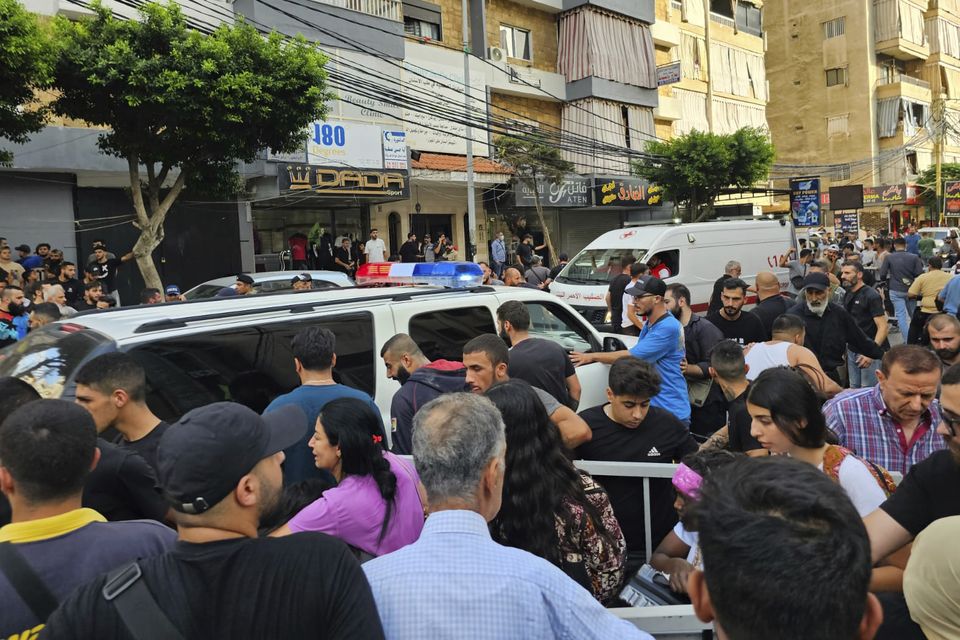 Ambulances arrive at the scene of an Israeli missile strike in the southern suburbs of Beirut (Hassan Ammar/AP)