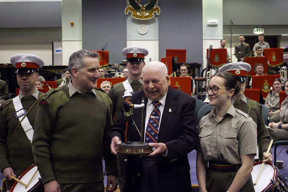 George Latham presents his drum major statue (Ministry of Defence/Crown Copyright/PA)