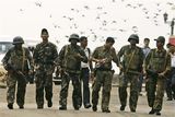 thumbnail: Indian commandos return after the completion of their operation inside the Taj Mahal hotel in Mumbai, India, Saturday, Nov. 29, 2008. Indian commandos killed the last remaining gunmen holed up at a luxury Mumbai hotel Saturday, ending a 60-hour rampage through India's financial capital by suspected Islamic militants that killed people and rocked the nation. (AP Photo/Gurinder Osan)