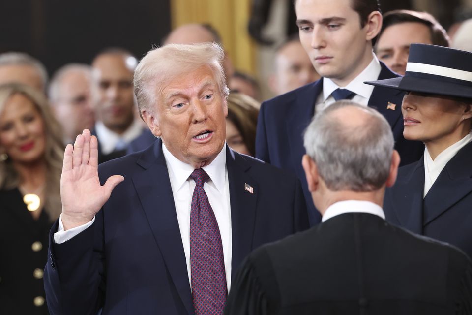 President-elect Donald Trump, from left, takes the oath of office (Kevin Lamarque/AP)