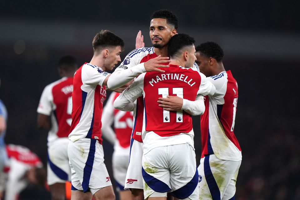 Arsenal players celebrate at full-time (Bradley Collyer/PA)