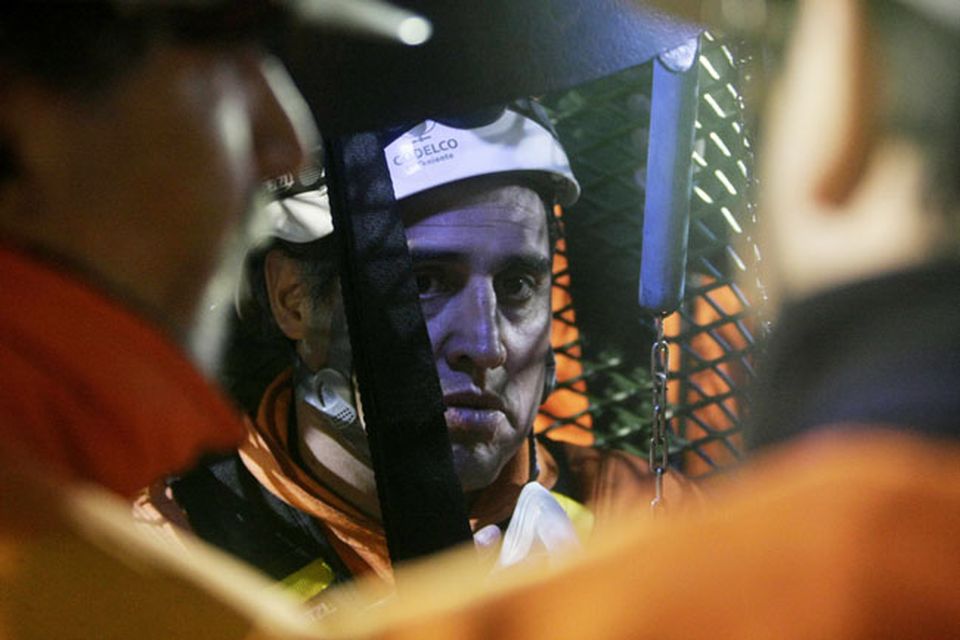 SAN JOSE MINE, CHILE - OCTOBER 13: (NO SALES, NO ARCHIVE) In this handout provided by the Chilean government October 13, 2010, Manuel Gonzalez, a rescue specialist from Codelco, stands in the rescue capsule at the San Jose mine near Copiapo, Chile. The rescue operation has begun bringing up the 33 miners, 69 days after the August 5th collapse that trapped them half a mile underground. Gonzalez was the first rescue worker to be lowered into the mine.  (Photo by Hugo Infante/Chilean Government via Getty Images)