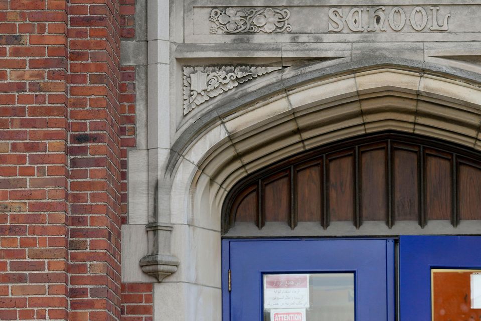 Voters depart a polling place at McDonald Elementary School in Dearborn, Michigan (Charlie Neibergall/AP)