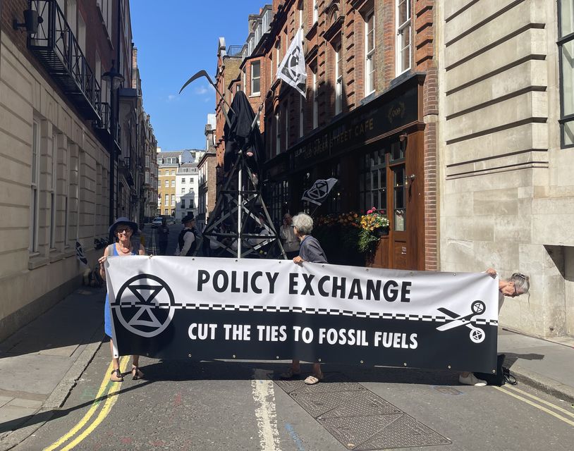 Extinction Rebellion protesters outside the offices of think tank Policy Exchange on Old Queen St, Westminster (Rosie Shead/PA)