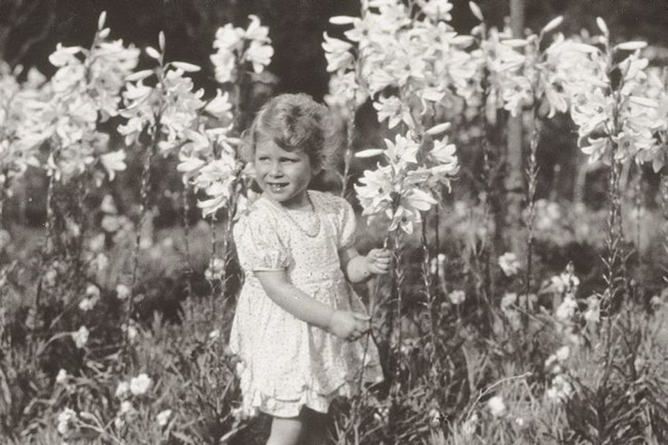 Princess Elizabeth of York with lilies in 1929