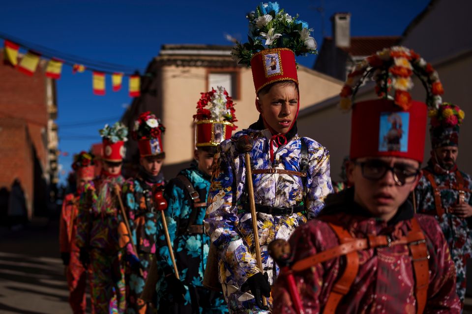 Only men born in the village or their descendants are part of the brotherhood (AP Photo/Manu Fernandez)