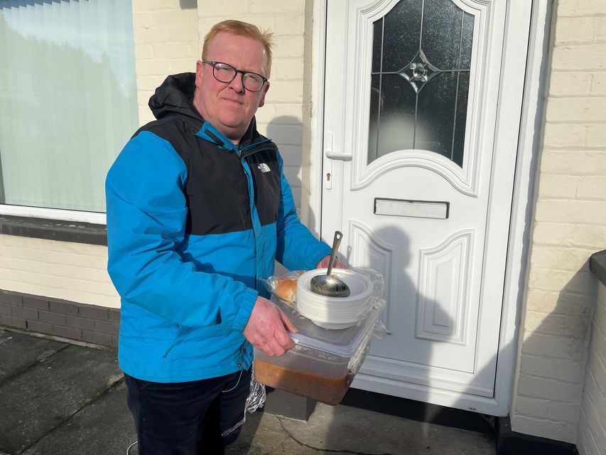 Lisburn and Castlereagh City councillor Alan Martin delivering hot food to residents who have been left without power (Jonathan McCambridge/PA)