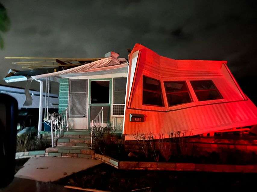 Damage to a mobile home in Harbor Lights Club, a mobile home park is shown on Long Bayou in St. Petersburg, Fla. after Hurricane Milton  (Tampa Bay Times via AP)