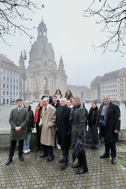 The duke poses for a photo in front of the restored church (Till Budde/British Embassy Berlin/PA)