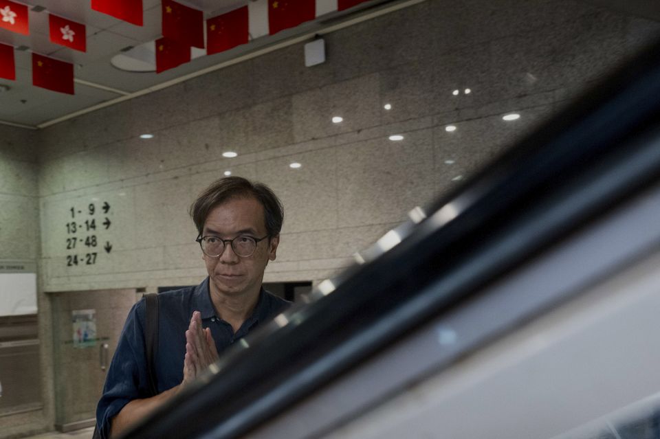 Chung Pui-kuen, the ex-chief editor of the now-shuttered Stand News online outlet, outside the district court, in Hong Kong (AP Photo/Billy HC Kwok)