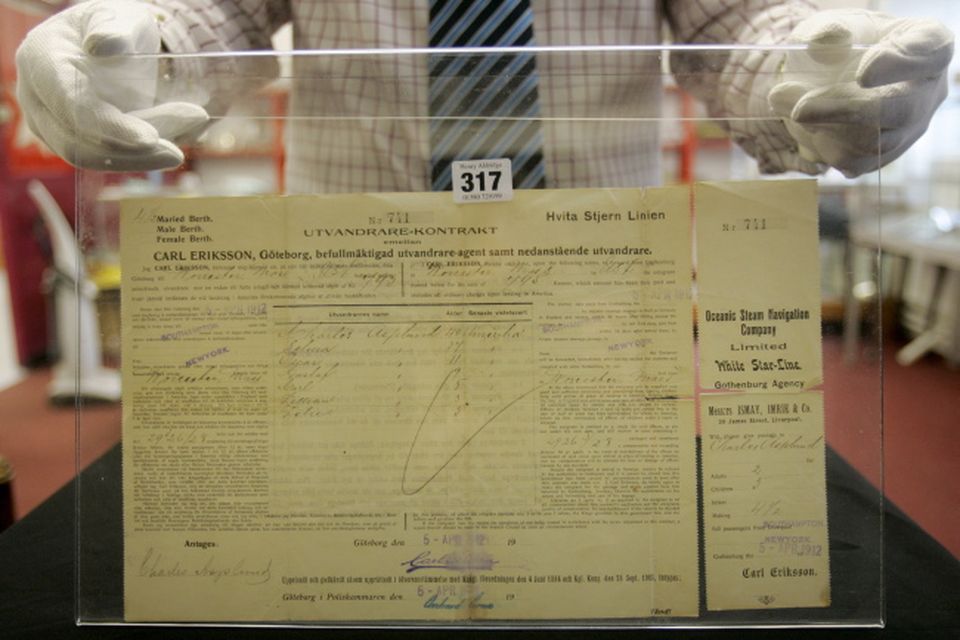 An emigration contract/ticket, purchased by the Asplund family for passage from Southampton to New York, and used on the Titanic, is seen at the Henry Aldridge and Son auctioneers in Devizes, Wiltshire, England Thursday, April 3, 2008. The locket and one of the rings were recovered from the body of Carl Asplund who drowned on the Titanic, they are all part of the Lillian Asplund collection of Titanic related items.