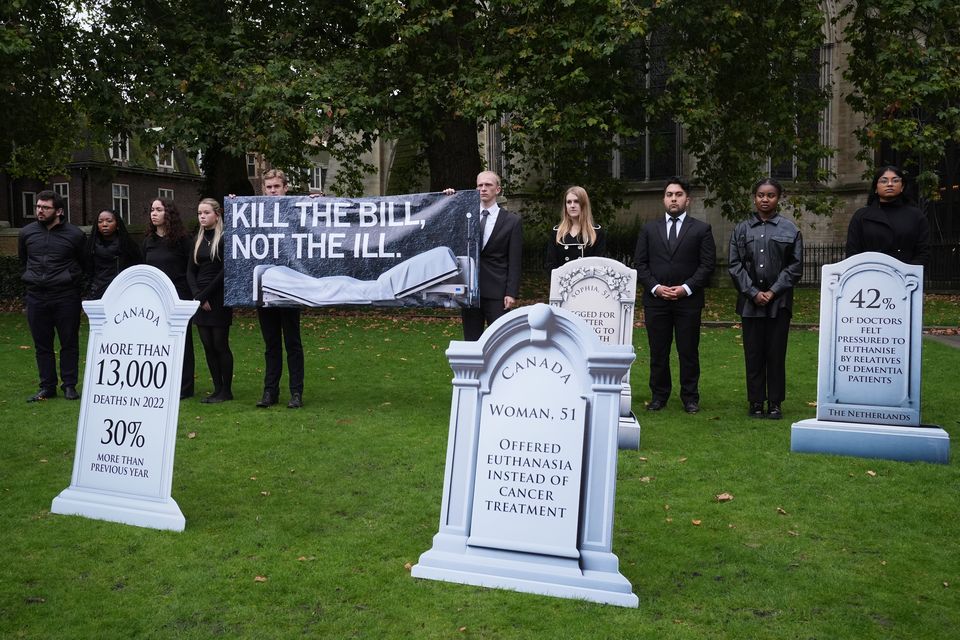 Campaigners opposed to a new assisted dying Bill gathered outside Parliament (Lucy North/PA)