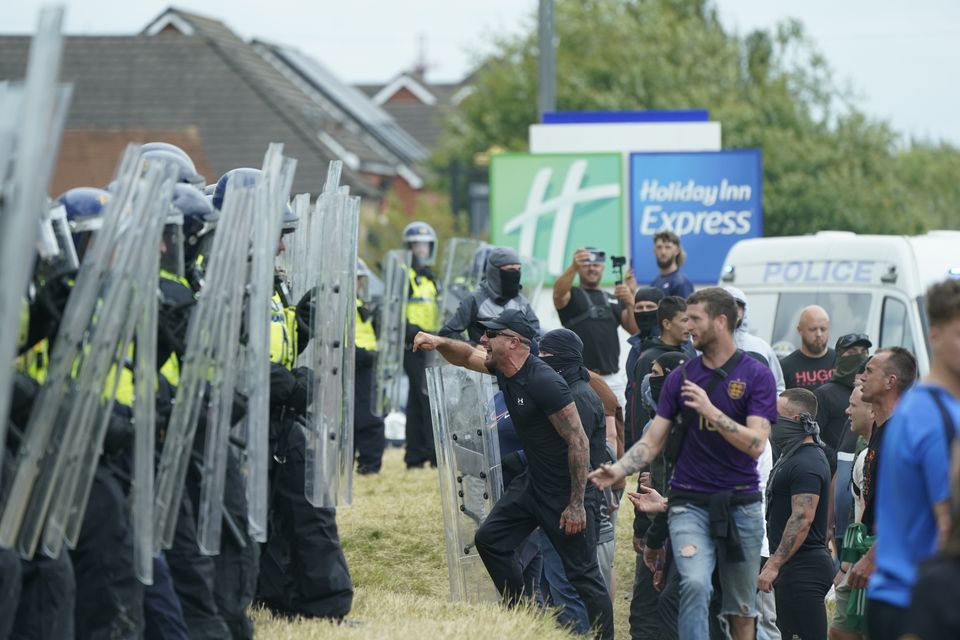 An anti-immigration demonstration outside the Holiday Inn Express in Rotherham (Danny Lawson/PA)