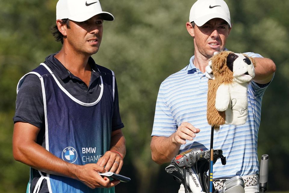 OLYMPIA FIELDS, ILLINOIS - AUGUST 28: Rory McIlroy (R) of Northern Ireland pulls a club on the ninth tee alongside caddie Harry Diamond (L) during the second round of the BMW Championship on the North Course at Olympia Fields Country Club on August 28, 2020 in Olympia Fields, Illinois. (Photo by Stacy Revere/Getty Images)