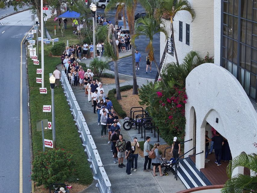 A line of voters as polls opened on election day in St Petersburg, Florida (Dirk Shadd/Tampa Bay Times via AP)