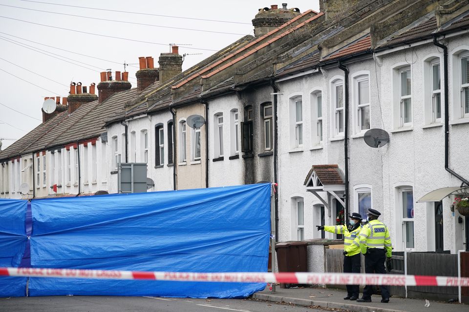 Police at the scene in Collingwood Road, Sutton, south London, where the two sets of twin boys died in a house fire (Yui Mok/PA)