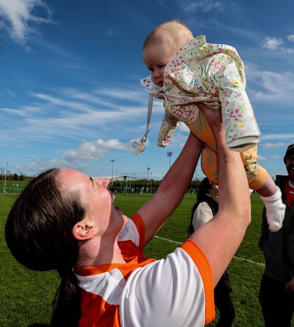 Armagh's Ciara Geoghegan celebrates with her daughter Erin after the Final victory over Laois