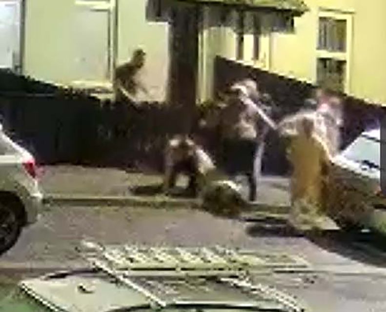 One woman crawls away as the enraged man attacks another, younger man