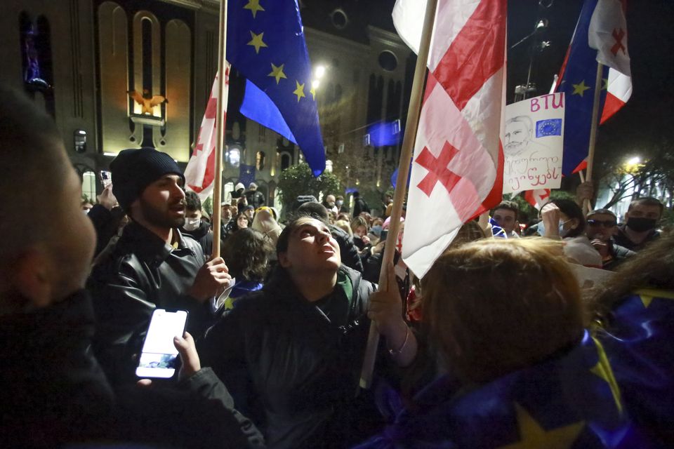 Protesters pour into the streets following the country’s ruling party suspended negotiations to join the European Union until 2028 (Zurab Tsertsvadze/AP)