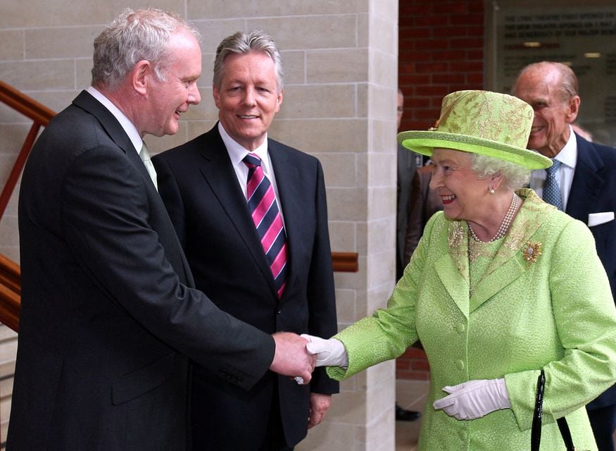 The famous handshake with Queen Elizabeth
