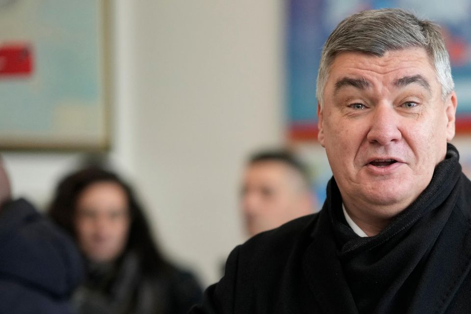 Zoran Milanovic casts his ballot at a polling station in Zagreb (Darko Bandic/AP)