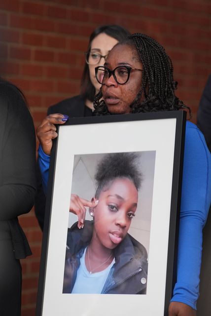 Hannah’s mother, Abimbola Duyile, holds a picture of her daughter outside East London Coroner’s Court (Yui Mok/PA)