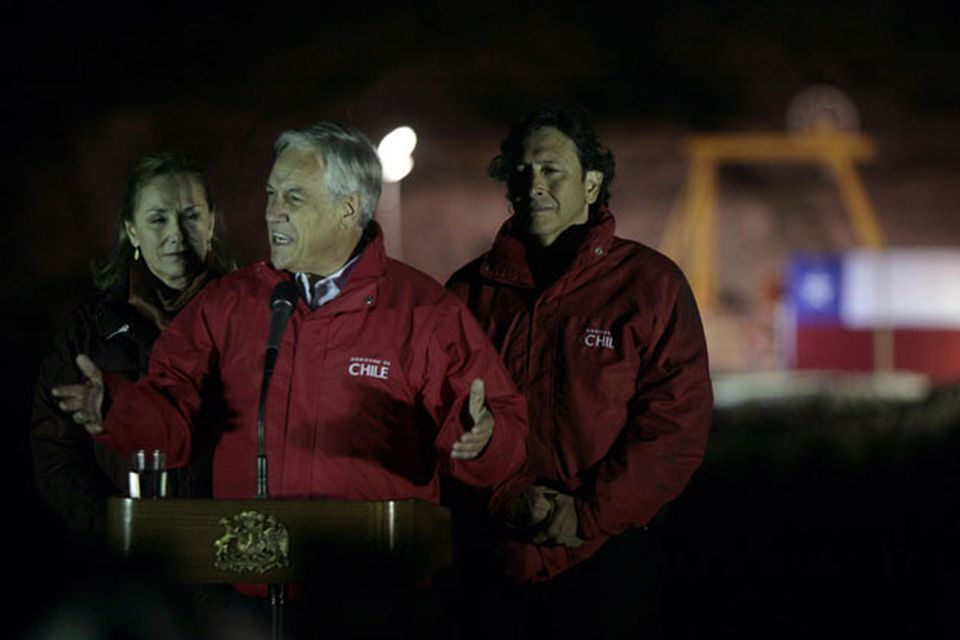 Chile's President Sebastian Pinera, center, first lady Cecilia Morel, left, and Mining Minister Laurence Goldburn, right, talk to the press after the rescue of the first of 33 trapped miners at the San Jose Mine near Copiapo, Chile Wednesday, Oct. 13, 2010.(AP Photo/Jorge Saenz)