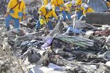 thumbnail: Police officers from Hyogo Prefecture search missing persons in the rubble in Kamaishi, Iwate Prefecture, northern Japan Monday, March 14, 2011 following Friday's massive earthquake and the ensuing tsunami. (AP Photo/Kyodo News)  JAPAN OUT, MANDATORY CREDIT, NO SALES IN CHINA, HONG  KONG, JAPAN, SOUTH KOREA AND FRANCE