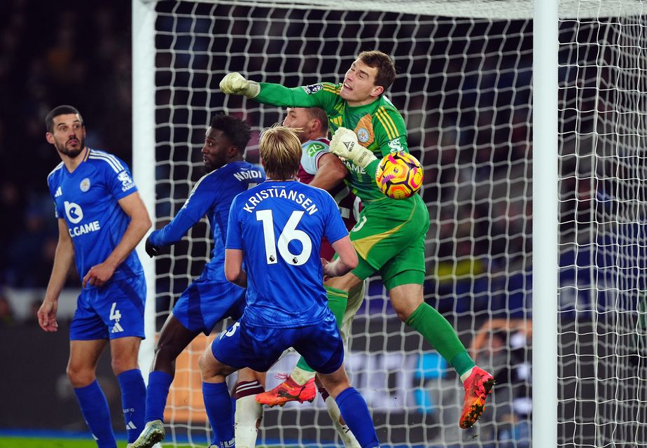 A foul is given against Tomas Soucek as Leicester goalkeeper Mads Hermansen punches into his own goal (Mike Egerton/PA)