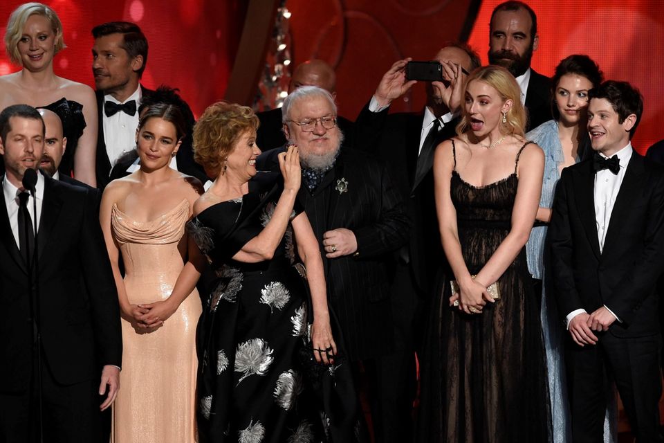Cast and crew of Game of Thrones, winners of the award for Outstanding  Writing for a Drama Series, appear backstage during the 70th annual  Primetime Emmy Awards at the Microsoft Theater in