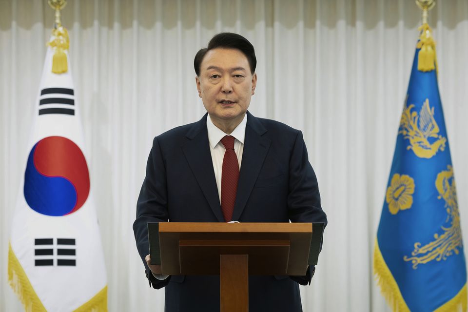 President Yoon Suk Yeol speaks at the presidential residence on December 14 (South Korean Presidential Office/Yonhap via AP)