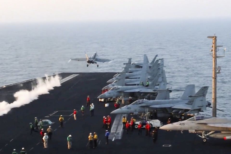 Aircraft launch from the USS Harry S Truman in the Red Sea before the air strikes (US Navy/AP)