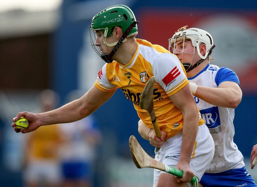 Antrim's Conal Bohill is tackled by Waterford's Padraig Fitzgerald during the sides' clash