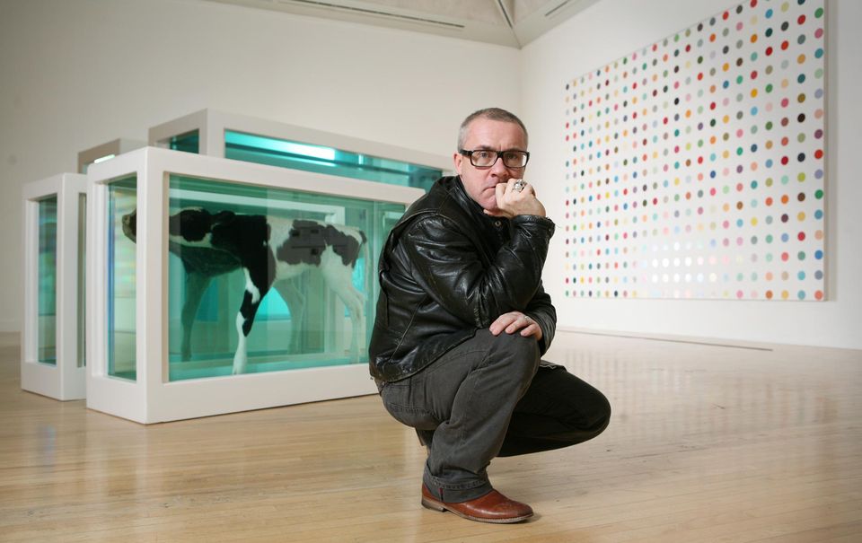 Damien Hirst with Mother and Child Divided 2007 in the exhibition Turner Prize: A Retrospective at Tate Britain (Andy Paradise/PA)