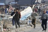 thumbnail: Residents head to search for missing people in Yamada, northern Japan Monday, March 14, 2011 following Friday's massive earthquake and the ensuing tsunami. (AP Photo/Kyodo News)  JAPAN OUT, MANDATORY CREDIT, NO SALES IN CHINA, HONG  KONG, JAPAN, SOUTH KOREA AND FRANCE