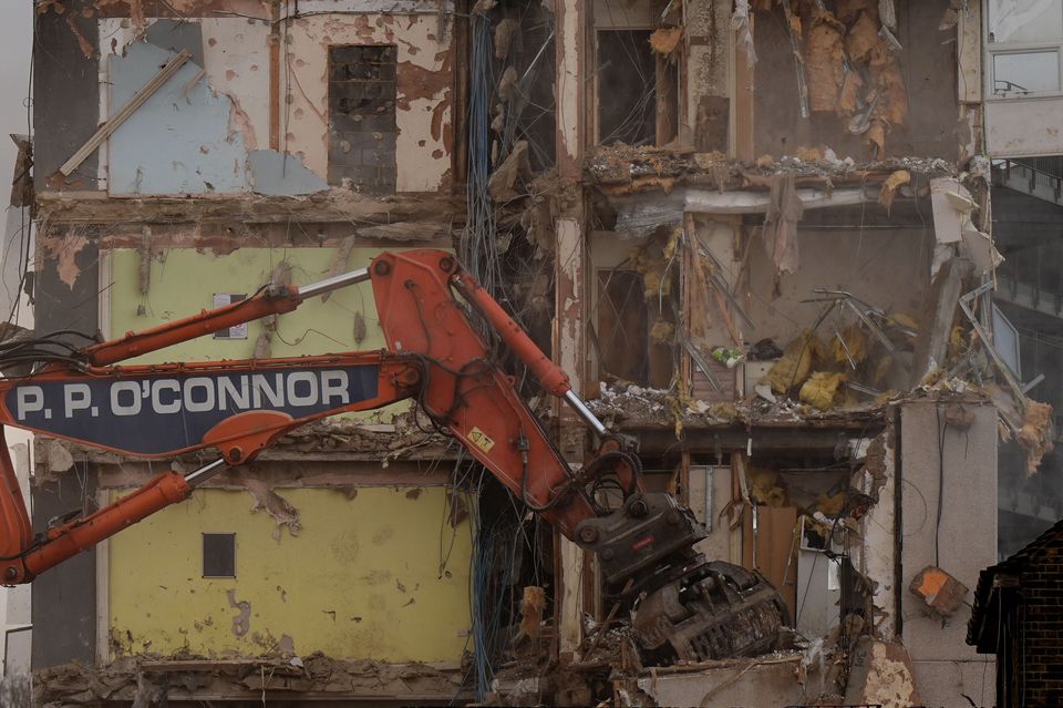 The interiors of the flats could be seen as the building was demolished (Aaron Chown/PA)